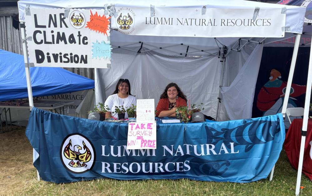 Lummi Climate Division Staff Shelbi and Savannah conducting community outreach at the 2025 Stommish Water Festival. Photo by Jeviah Magana.